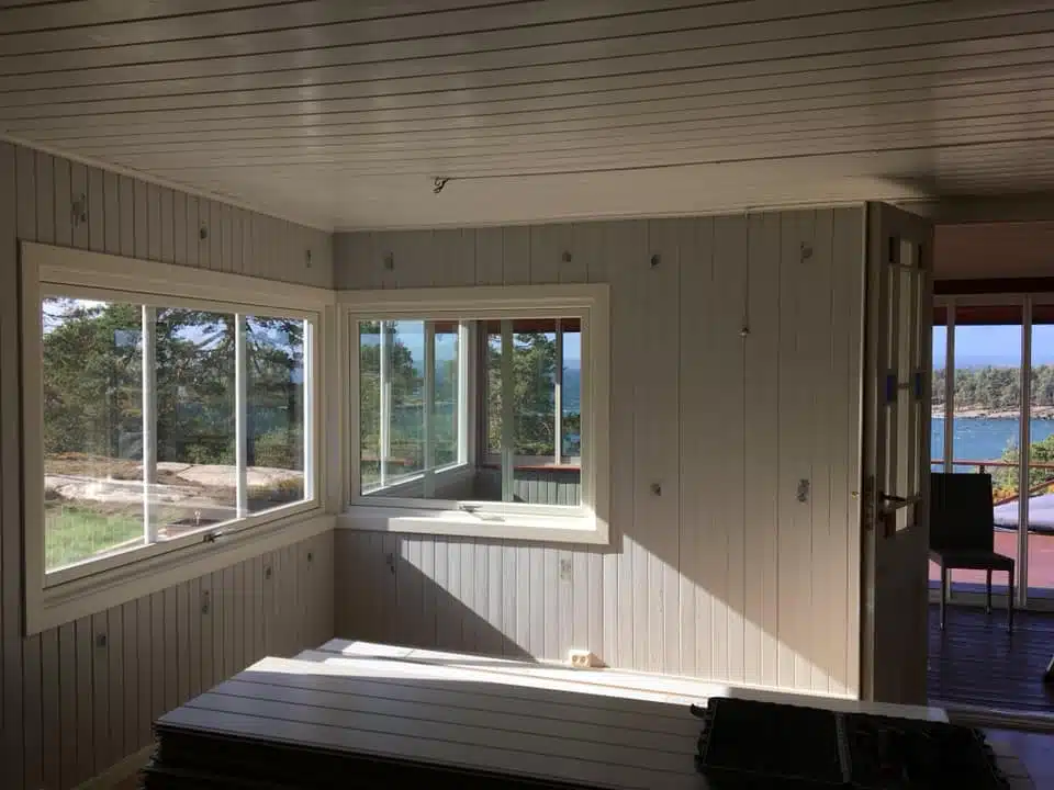 Etterisolering av hus med blåseisolering